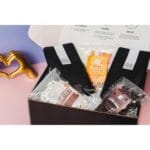 Mother's Day Coffee Gift Box, Gift For Mom - Blueberry Cobbler Ground Coffee, Columbian Medium Roast, Yogurt-Covered Pretzels, Universal K-Cup Adapter, Honey Sticks, and Chocolate-Covered Coffee Beans