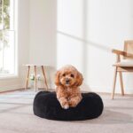 Dog & Cat Bed: Round Faux Fur Pet Bed - Plush, Cozy, & Calming Donut Bed for Medium Pets - Soft & Comfortable Sleeping Cushion for Napping & Lounging, 23" Round, Black