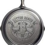 Lodge Pre-Seasoned Yellowstone Stamped Cast Iron Cookware - Signature Teardrop Handle - Use in the Oven, on the Stove, on the Grill, or Over a Campfire - 12 Inch Logo Skillet